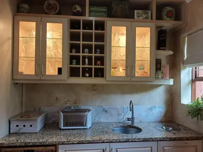 a kitchen with a sink and a counter top at A Jungle House in Somerset West