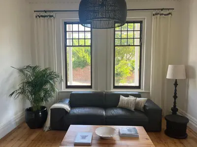 a living room with a couch and a table at The Alma House 1900 in Cape Town