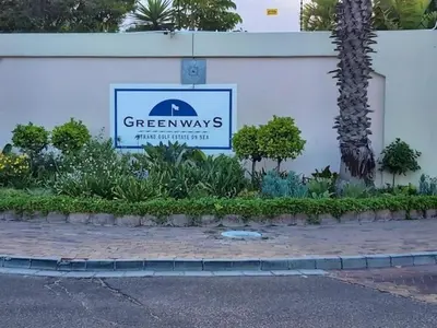 a green ways sign on a building with plants at Golfbeach Luxury self catering apartment in Cape Town
