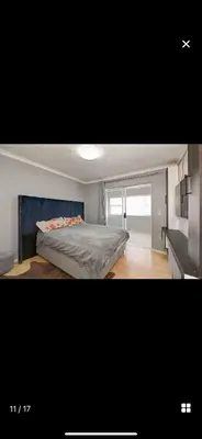 a bedroom with a large bed in a room at YA Eagle Wings Self Catering Shared Single Room Lodge A in Cape Town