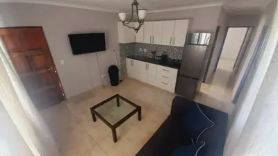 an overhead view of a kitchen with a table in it at Zoe Apartment in Cape Town