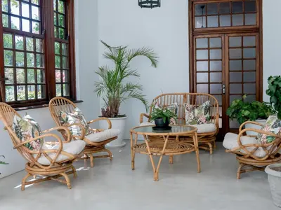 a group of chairs and a table in a room at Vendome Wine Estate in Paarl