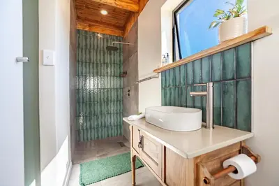 a bathroom with a sink and a shower at Lily's Pad in Oakdale