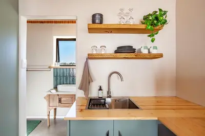 a kitchen with a sink and a counter at Lily's Pad in Oakdale