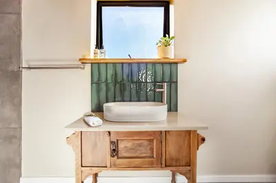 a bathroom vanity with a sink and a window at Lily's Pad in Oakdale