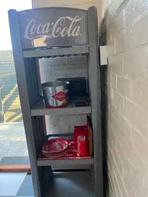 a coca cola refrigerator in a brick wall at The Cola Cabana in Cape Town