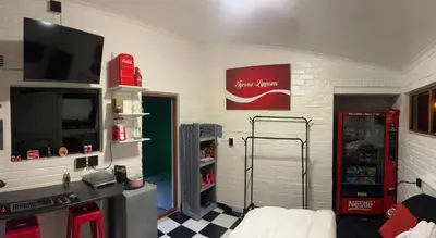 a room with a coca cola machine in a room at The Cola Cabana in Cape Town