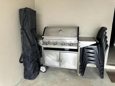 a kitchen with a stove and a table and chairs at Laid-Back Tortoise in Fisherhaven