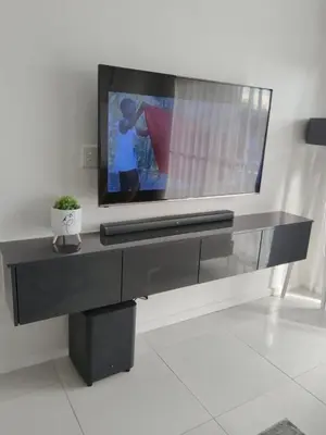 a flat screen tv sitting on top of a table at 2 bed Luxury apartment living in Cape Town