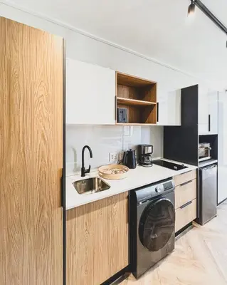 a kitchen with a stove and a dishwasher at Grace On Park by Dajosha in Cape Town