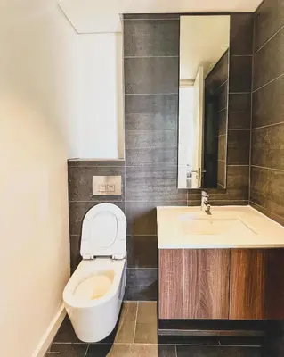 a bathroom with a toilet and a sink at Shalom on Matrix by Dajosha in Cape Town