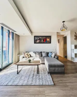 a living room with a couch and a coffee table at Shalom on Matrix by Dajosha in Cape Town