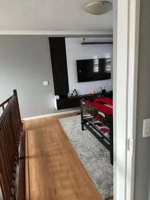 a living room with a pool table and a tv at YA Eagle Wings Self Catering Shared Single room Lodge B in Cape Town