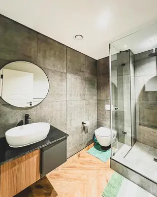 a bathroom with a sink and a toilet and a mirror at Love on Park by Dajosha bookings in Cape Town