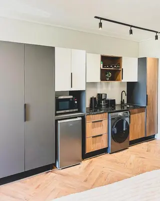 a kitchen with a washer and a dishwasher at Love on Park by Dajosha bookings in Cape Town