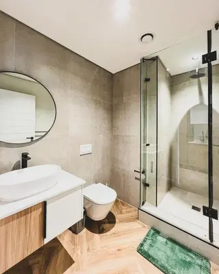 a bathroom with a sink toilet and a shower at Joy On Park by Dajosha Bookings in Cape Town