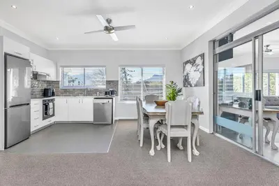 a kitchen and dining room with a table and chairs at Self-Catering Winelands Views Apartment Stellenbosch in Stellenbosch