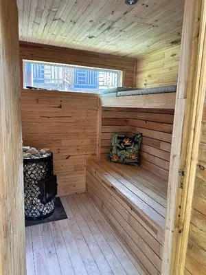 a sauna with a bench in a wooden cabin at Blue Cottage, Elgin Grabouw in Grabouw