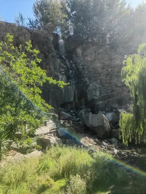 a waterfall on the side of a rocky mountain at Water front apartment-Ocean Palace in Tyger Valley