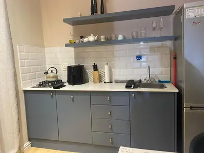 a small kitchen with a sink and a stove at The eden in Faure