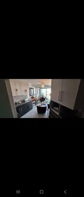 a view of a kitchen with a sink and a stove at 210 at Beach in Strand