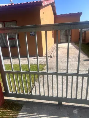a metal fence in front of a building at Bergstreet in Hermanus