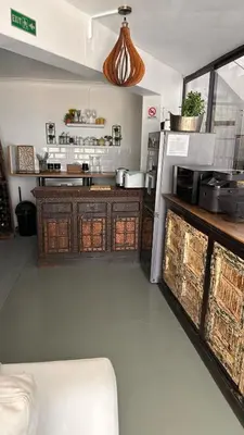 a room with a kitchen with a counter and a unintention at Coral Vistas Self Catering Apartments in Gordonʼs Bay