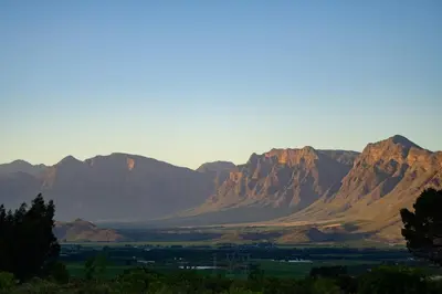 a view of a mountain range with mountains in the background at Breedekloof Kajuit in Romansrivier