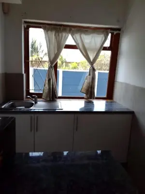 a kitchen with a sink and a window at At-home Oakdale Bellville in Bellville
