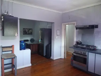 a kitchen with a stainless steel refrigerator and a stove at At-home Oakdale Bellville in Bellville