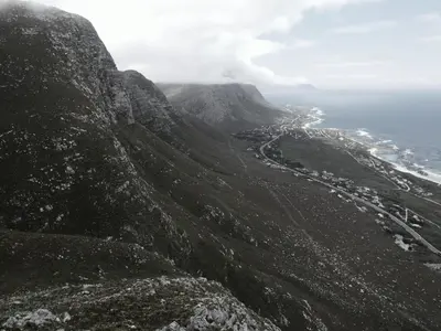 a view of the ocean from the top of a mountain at Nature's Nest in Bettyʼs Bay