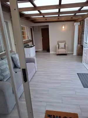 a living room with a couch and a chair at Chez Yves 2 in Hoheizen