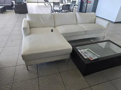 a white couch and a coffee table in a store at Sunset at Keys in Cape Town