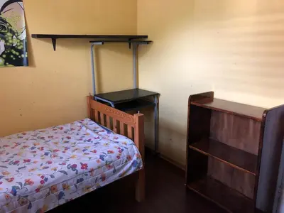 a small bedroom with a bed and a dresser at Home from Home in Welton