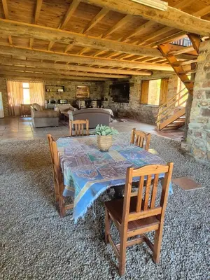 a dining room with a table and chairs in a room at Avondrood Mountain House in Rawsonville