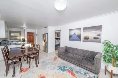 a living room with a couch and a table at Prime Apartments in Richwood