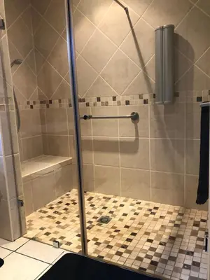 a shower with a glass door in a bathroom at Charming Self-Catering Apartment in Tygerberg Hills