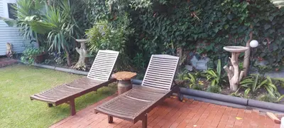 two chairs and a table on a patio at Amanda's Place in Hermanus