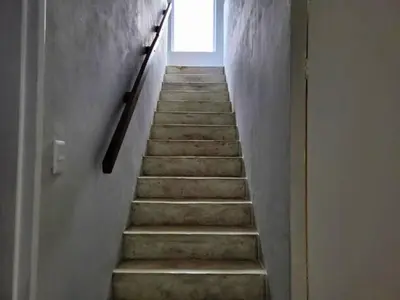 a stairway leading up to a door with a window at Silvertree Collective Ocean and Mountain View in Bettyʼs Bay
