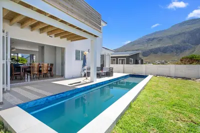 a swimming pool in the backyard of a house at Metalasia Four in Bettyʼs Bay