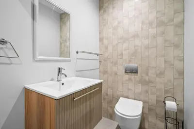 a bathroom with a sink and a toilet at Metalasia Four in Bettyʼs Bay