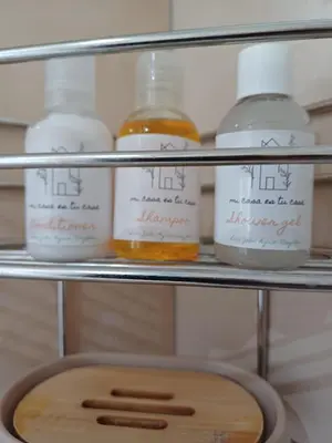 a shelf with several bottles of honey in a refrigerator at Stylish Studio in Tableview Stay in Cape Town