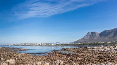 a view of a river with mountains in the background at Geheim Luxury Seafront in Hermanus