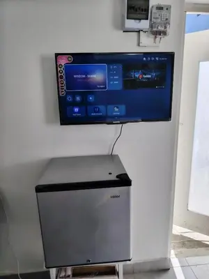 a computer monitor sitting on top of a wall at Kenwyn Micro Apartments 2 in Cape Town