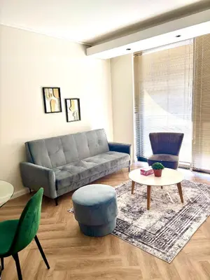 a living room with a couch and a table at Modern Luxe On Park in Cape Town