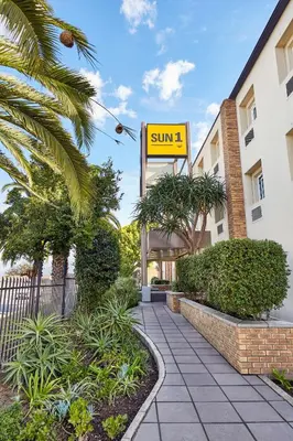 a sign that reads sun in front of a building at SUN1 Parow Cape Town in Avondale