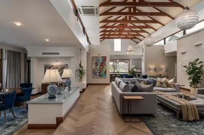 a large living room with couches and chairs at Franschhoek Homestead Manor House in Franschhoek
