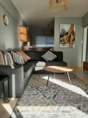 a living room with a couch and a coffee table at Pips Place 203 in Strand