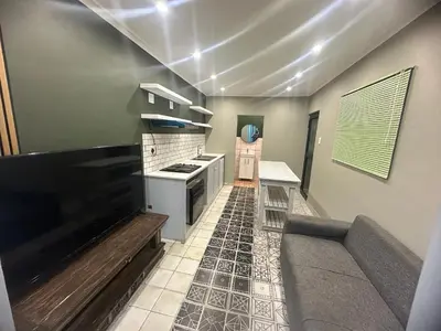 a kitchen with a stove and a counter top at 29Windsor in Silver Sands