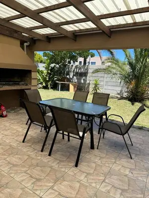 a black table and chairs on a patio at Hideaway Haven 2 in Cape Town